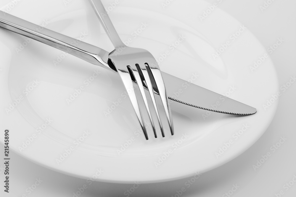 Fork, knife and plate close-up