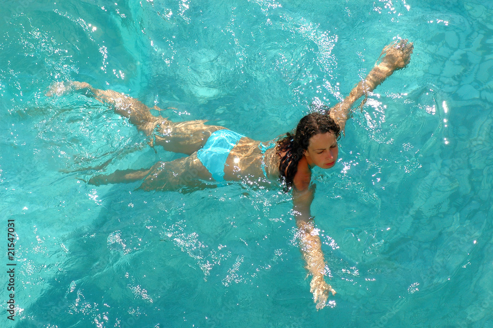 Woman swimming in water pool