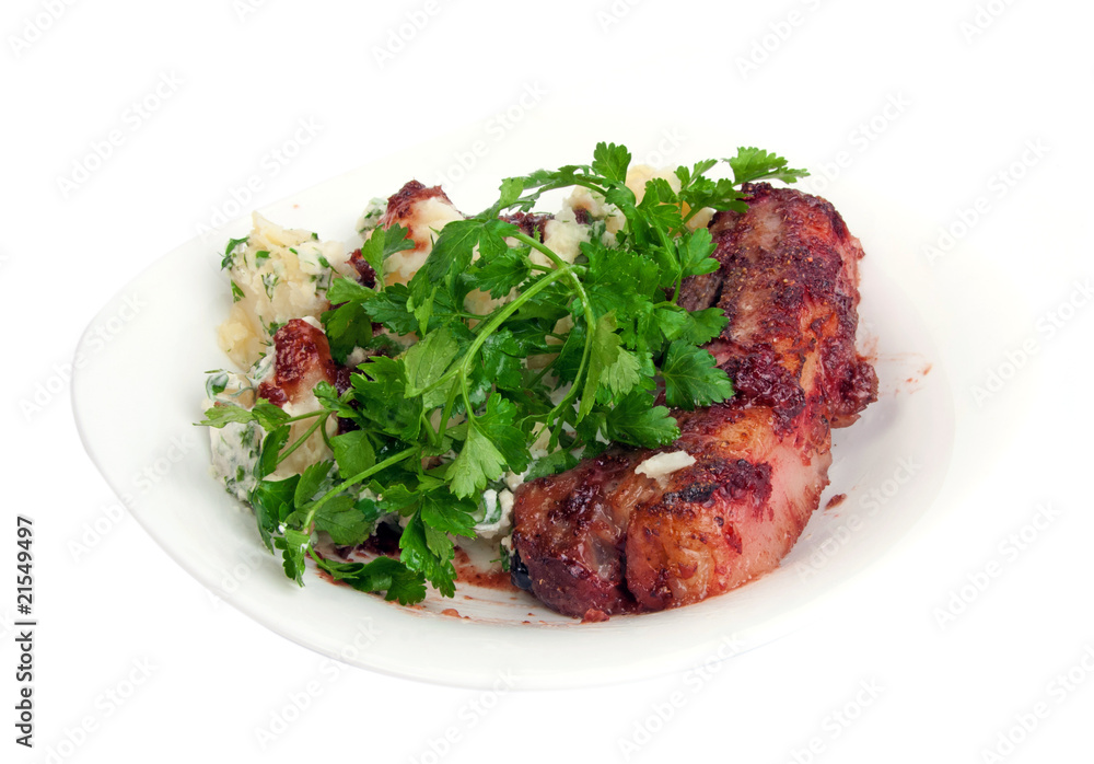 Pork ribs in cranberry sauce with potato and parsley