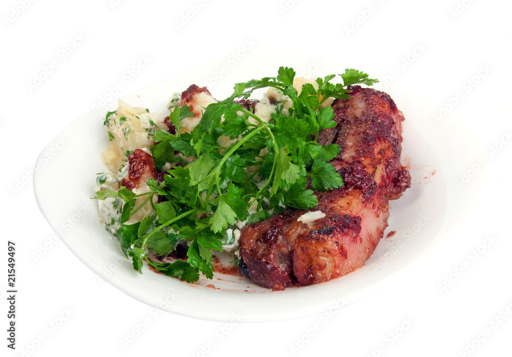 Pork ribs in cranberry sauce with potato and parsley Pork ribs in cranberry sauce with potato and parsley