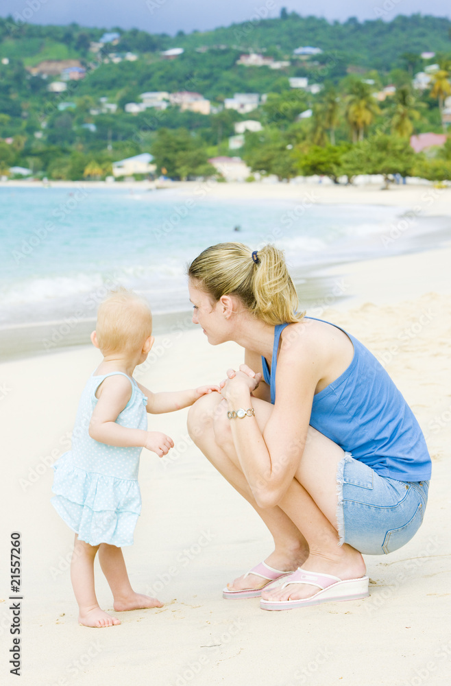 woman with toddler on the beach; Grand Anse Bay; Grenada woman with toddler on the beach; Grand Anse Bay; Grenada