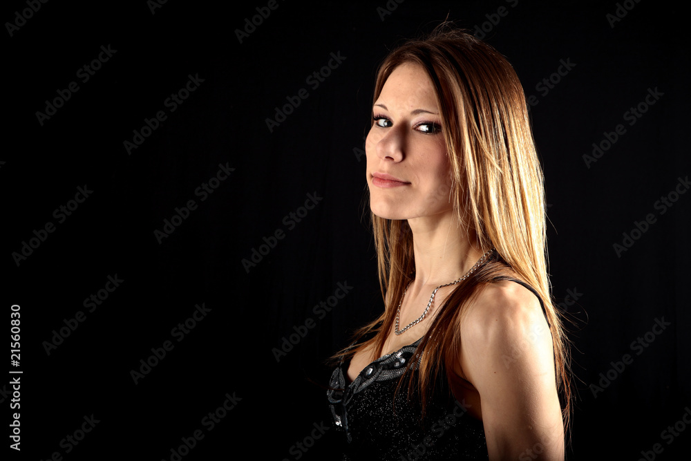 Sexy young woman in smart evening dress