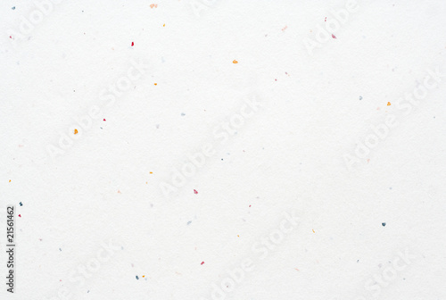 Blank white hand-made textured paper background with colored par