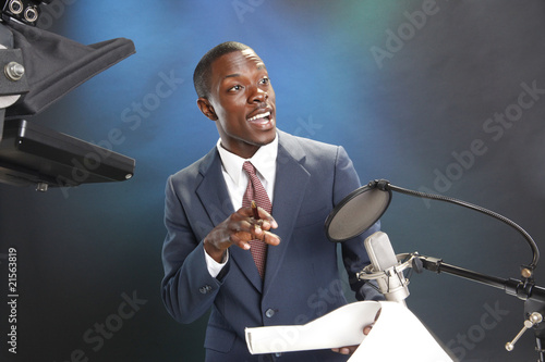 TV/Radio news anchor with prompter and microphone