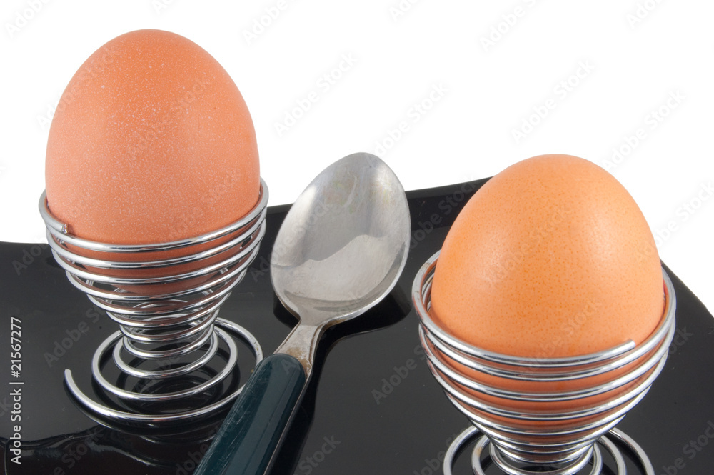 boiled eggs with spoon isolated on white background boiled eggs with spoon isolated on white background