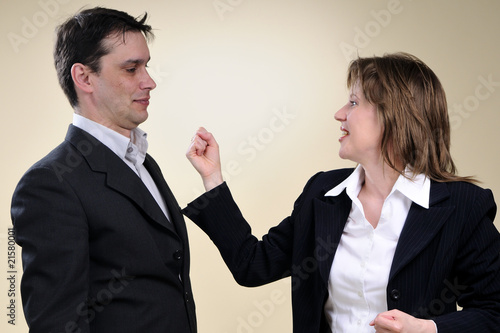 business man and woman fighting with crisis
