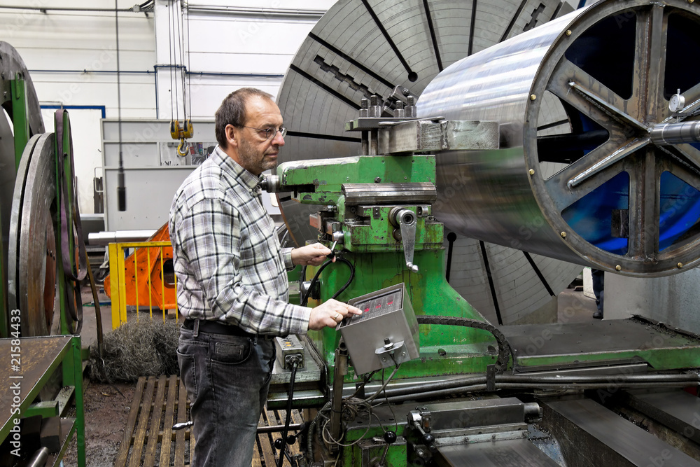 Older workers in the metal industry with CNC milling machine. Older workers in the metal industry with CNC milling machine.