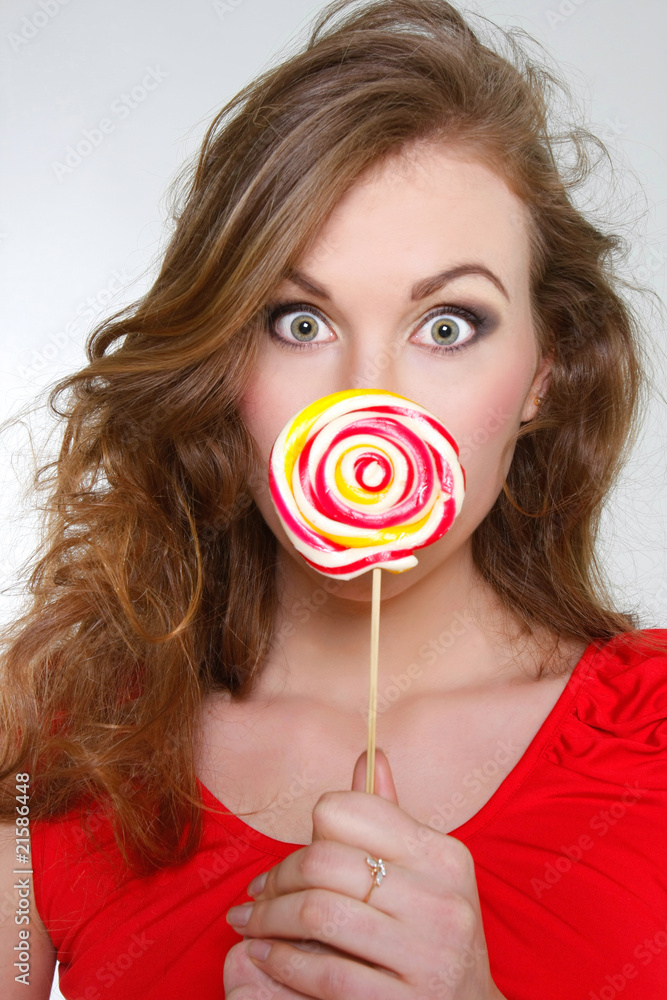 young beautiful woman with big lollipop