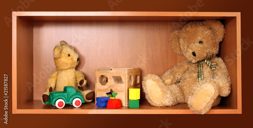 Cute bears on the wooden toy shelf