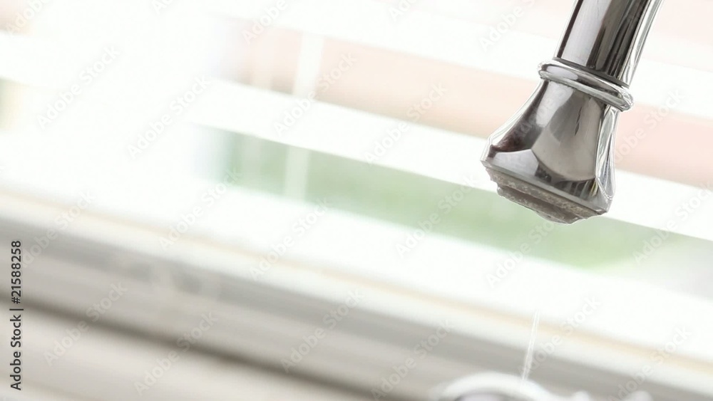 Water Wastefully Dripping from Sink Faucet Water Wastefully Dripping from Sink Faucet