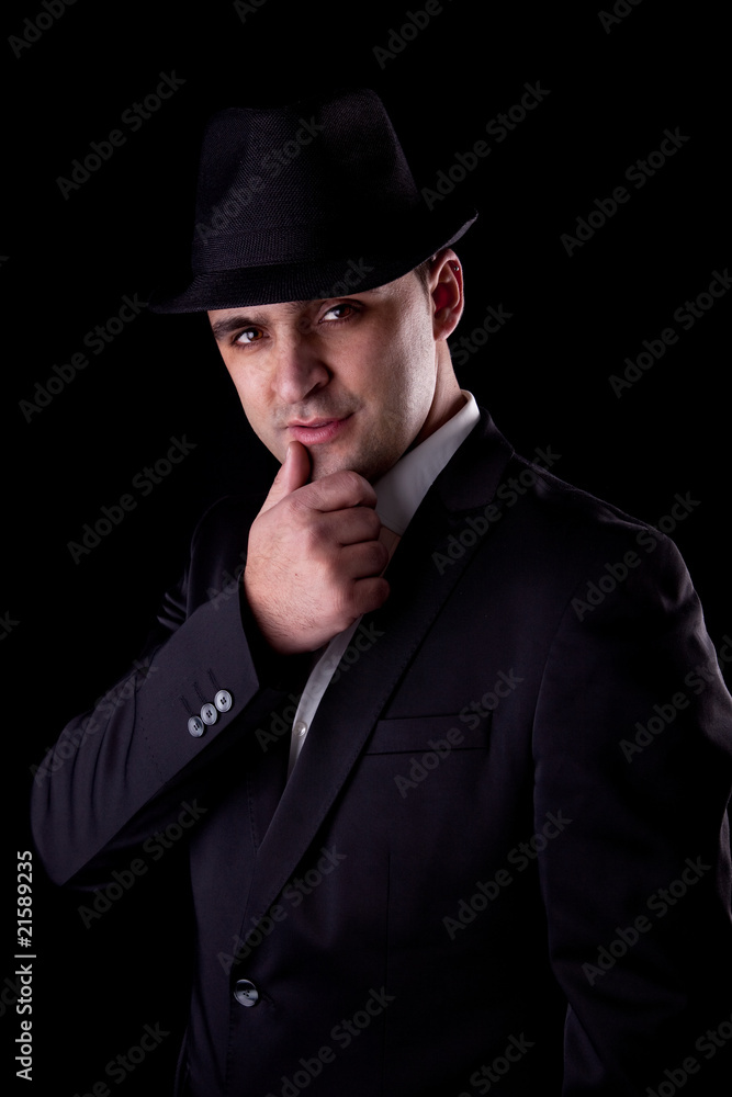man with his hand to his lips in a seductive pose man with his hand to his lips in a seductive pose