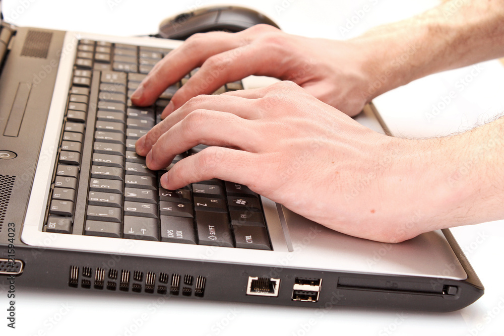 Closeup of male fingers typing a document on the black laptop Closeup of male fingers typing a document on the black laptop