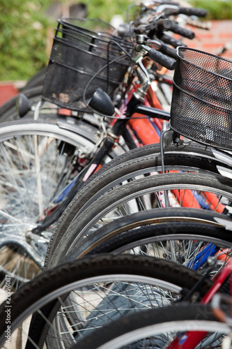 lots of bicycles on a bicycle rack