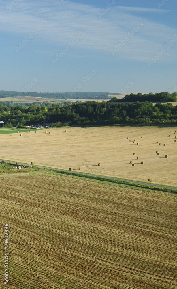 Fototapeta premium Aerial of harvest fields in summertime, France