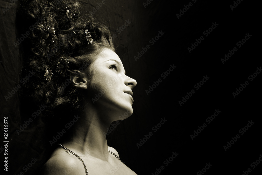 Portrait of a happy women  with flowers in her hair..