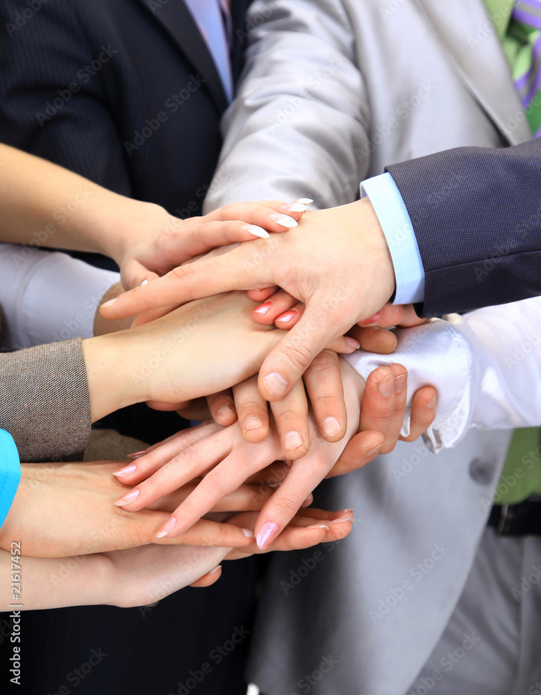 Hands piled on top of one another.. Hands piled on top of one another..
