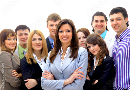 Smiley businesswoman with a group behind him.