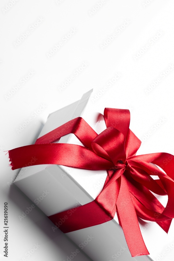 Gift decorated with a tape and a bow Gift decorated with a tape and a bow