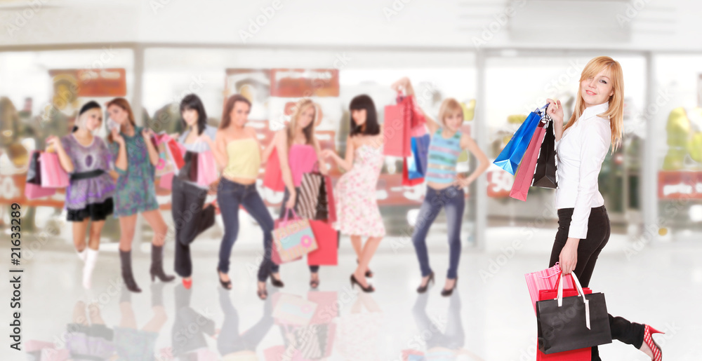Obraz premium group of friends shopping in a mall