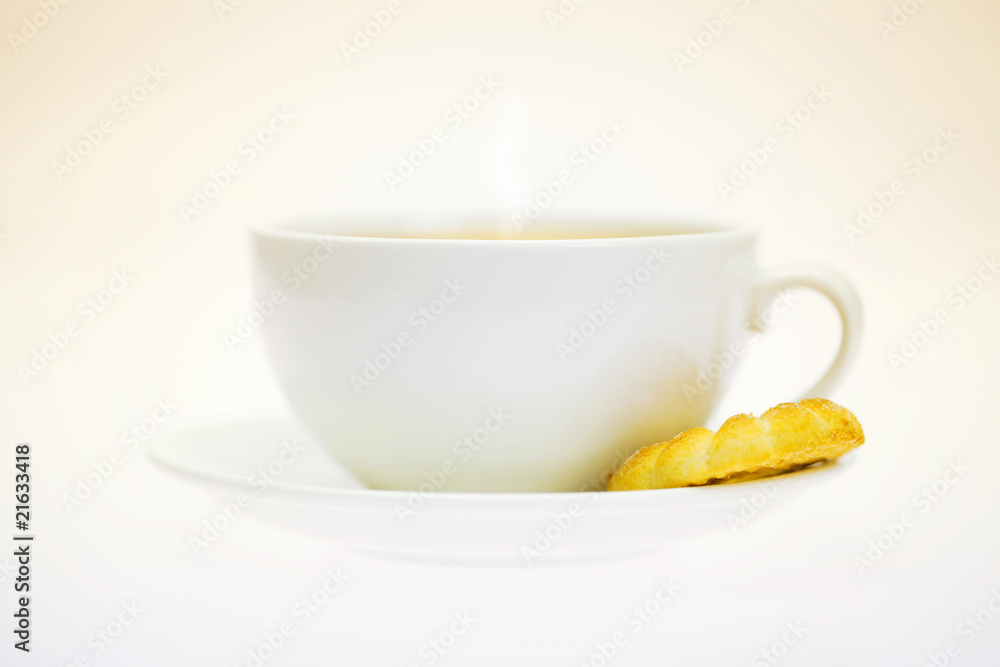 white cup and pastry isolated on white white cup and pastry isolated on white