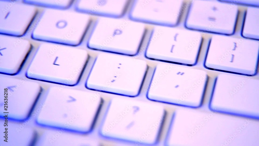 Keyboard track shot. Purple lighting to create high tech mood. Keyboard track shot. Purple lighting to create high tech mood.