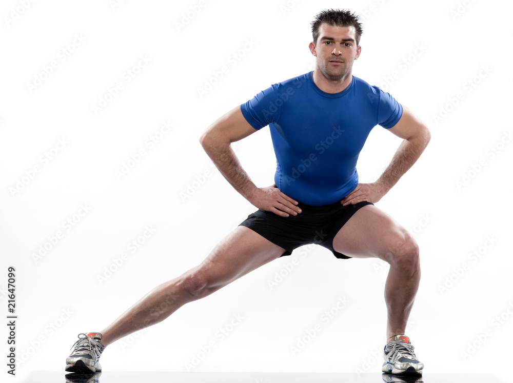 stretching posture by a man on studio white background stretching posture by a man on studio white background