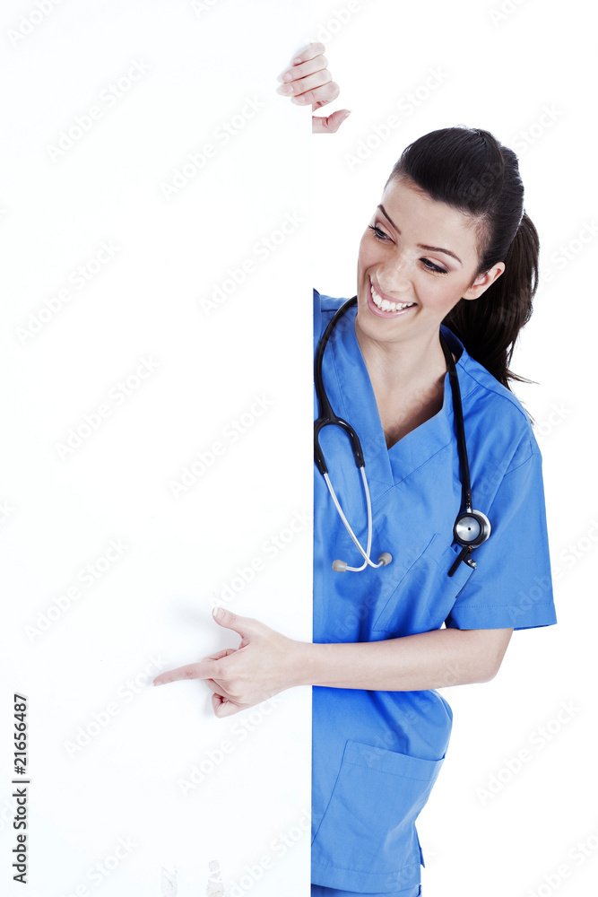 Portrait of female nurse standing behind the white board