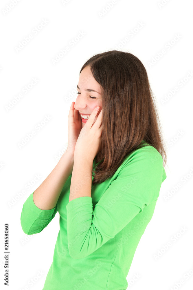 Portrait of young teenage girl laughing, studio shot Portrait of young teenage girl laughing, studio shot