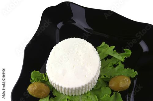soft feta cheese on black dish