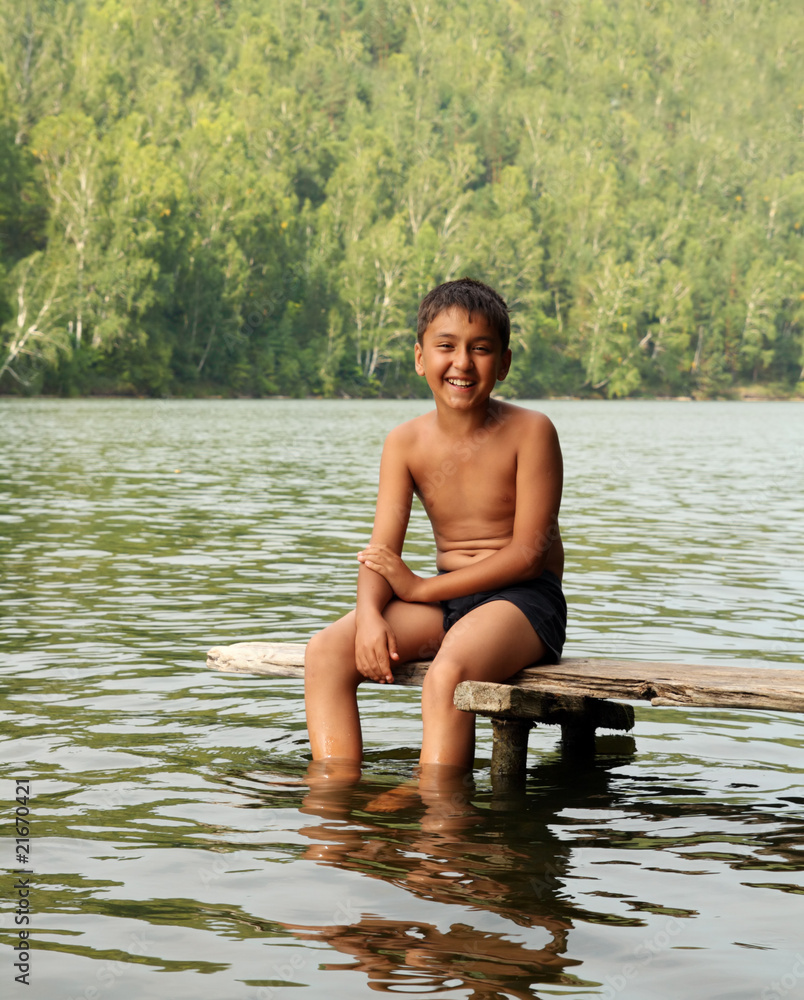 Fototapeta premium boy sitting on stage