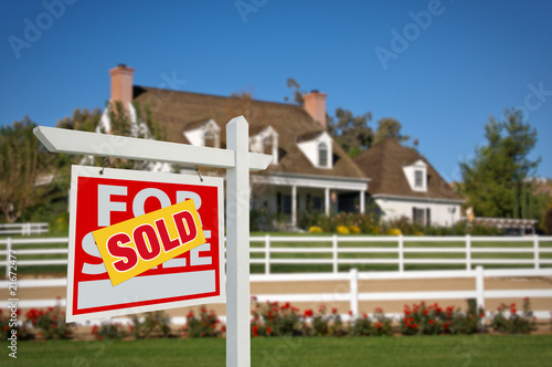 Sold Real Estate Sign and House