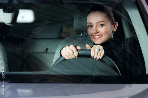 young pretty woman driving car
