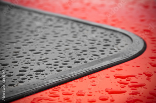 abstract of raindrops around a vehicle window seal