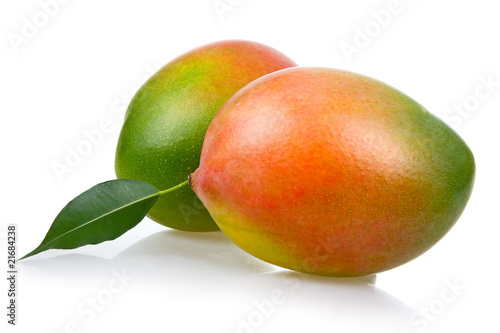 Ripe mango fruits with leaves isolated