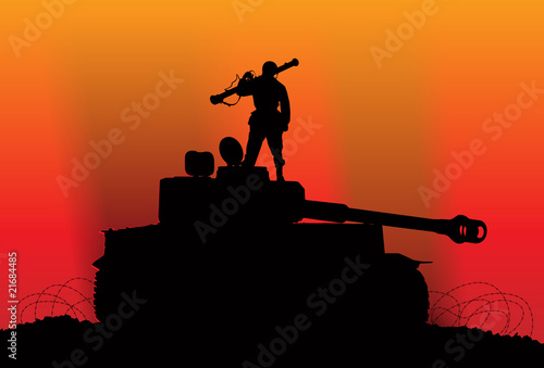 Victory. Silhouette of a soldier on the destroyed enemy tank