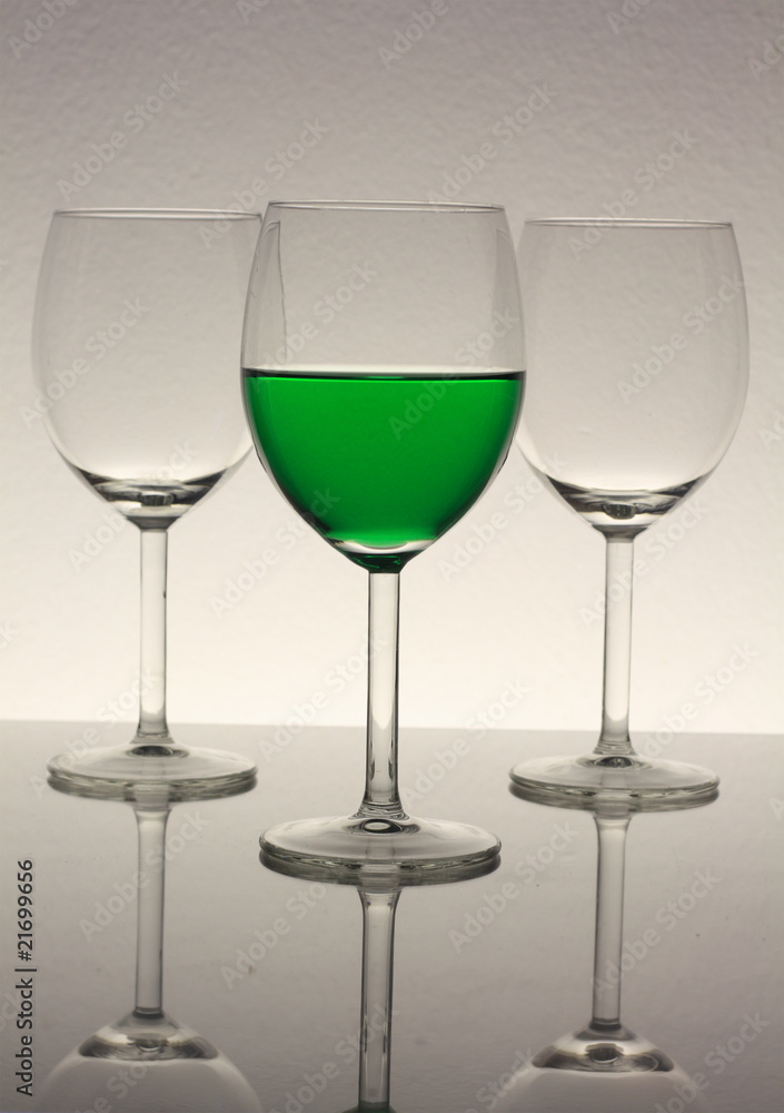 wine glasses with green wine