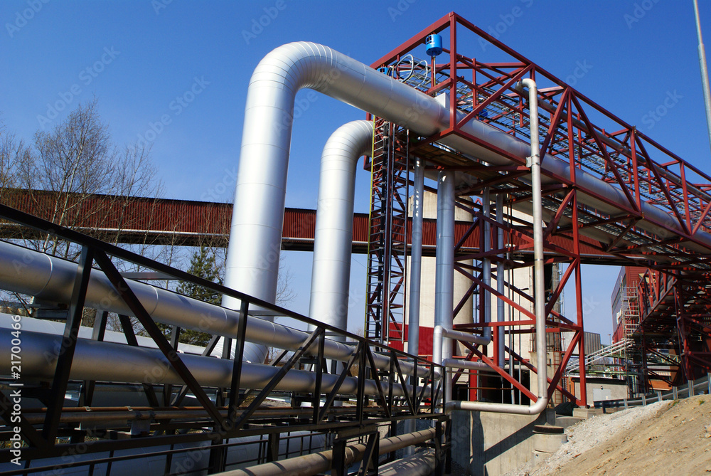 industrial pipelines on pipe-bridge against blue sky industrial pipelines on pipe-bridge against blue sky