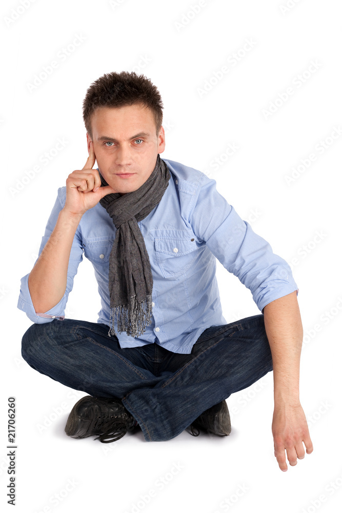 Thoughtful Man Sitting with Legs Crossed Thoughtful Man Sitting with Legs Crossed
