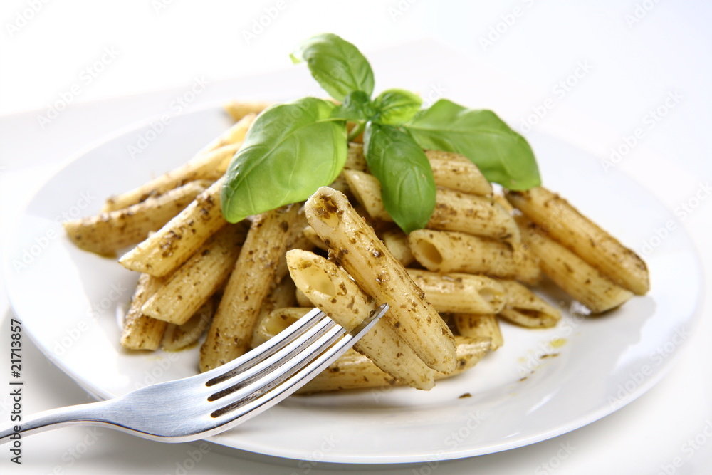 Penne with pesto decorated with basil Penne with pesto decorated with basil