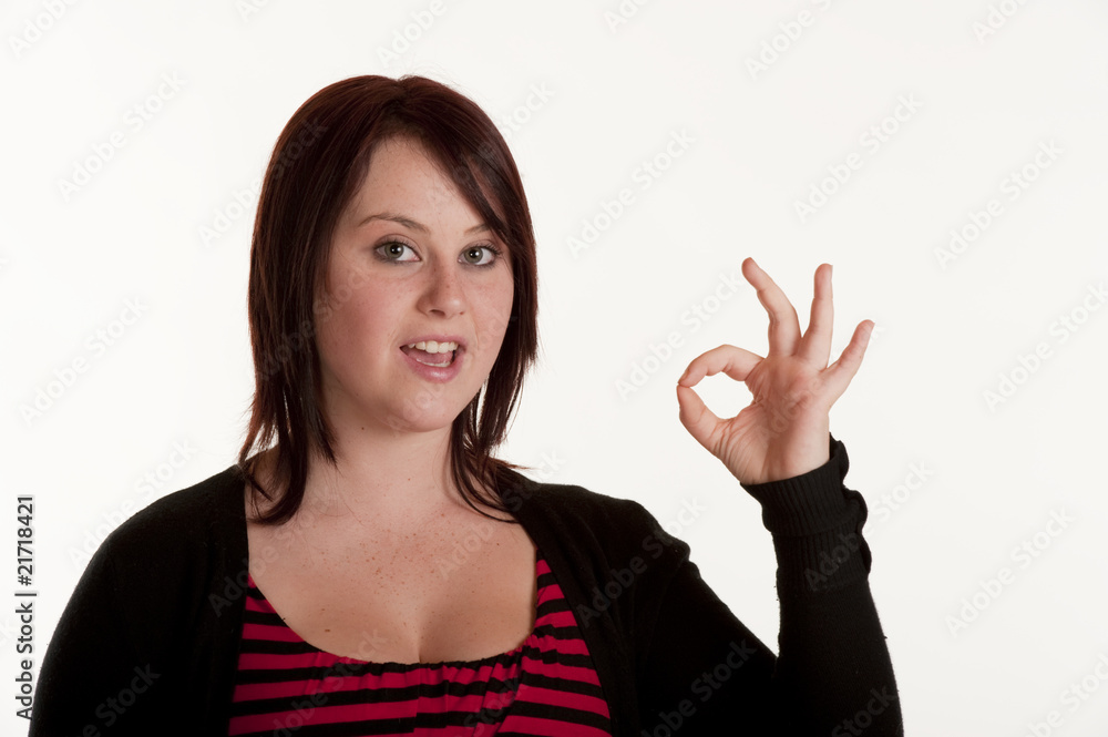 beautiful teenage girl making OK sign beautiful teenage girl making OK sign