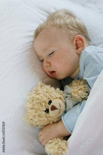 Baby sleeping in bed