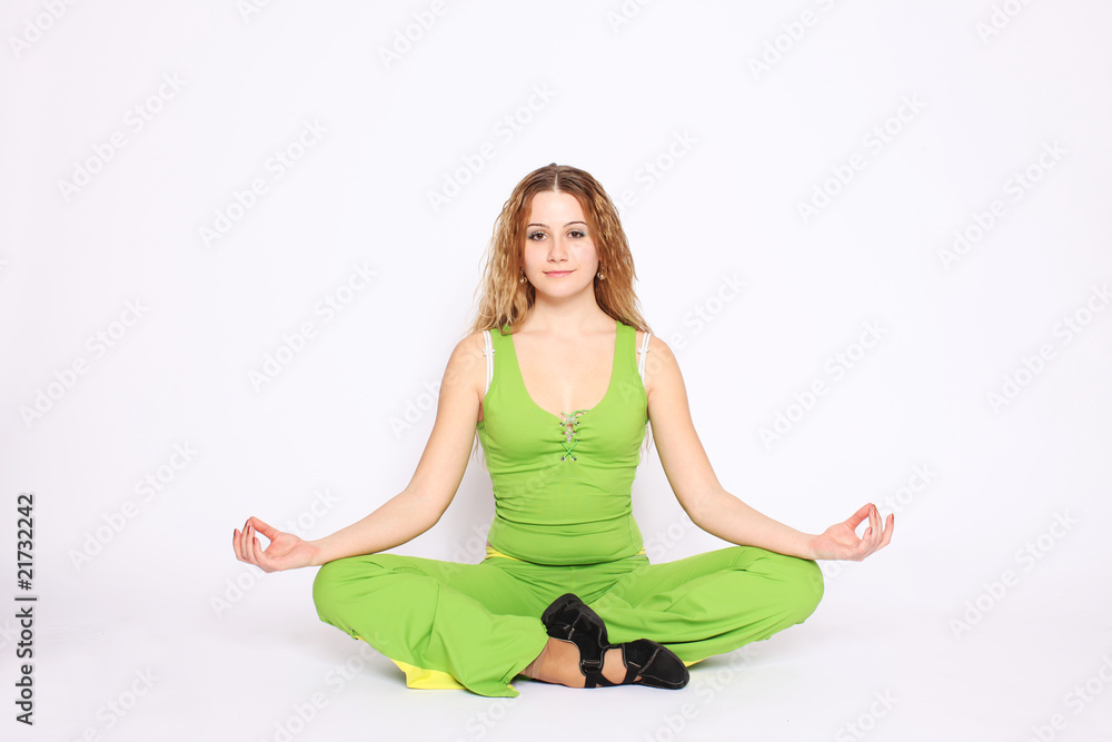 Young pretty woman sitting in pose of lotus Young pretty woman sitting in pose of lotus