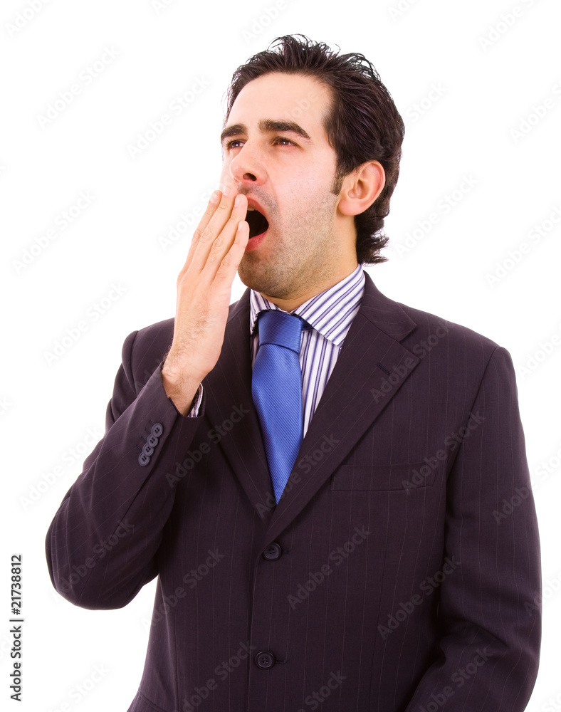 yawning young business man, isolated on white background yawning young business man, isolated on white background