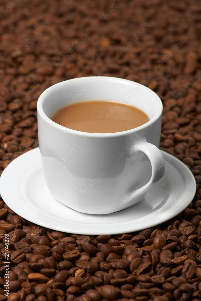 Cup with coffee, costing on coffee grain Cup with coffee, costing on coffee grain