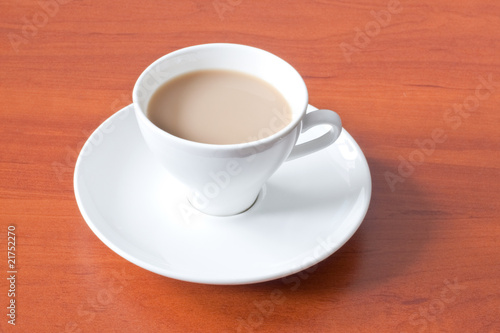 coffee in white cup over table
