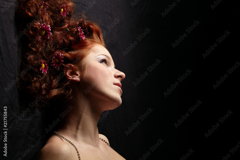 Portrait of a happy women with flowers in her hair.. Portrait of a happy women with flowers in her hair..