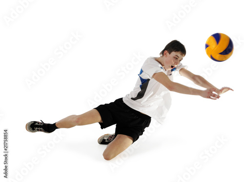 Volleyball player in high flying with a ball