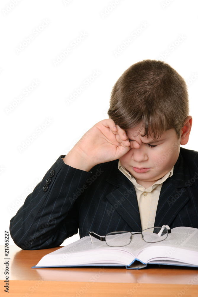 Boy wearing spectacles masses an eye for weariness Boy wearing spectacles masses an eye for weariness
