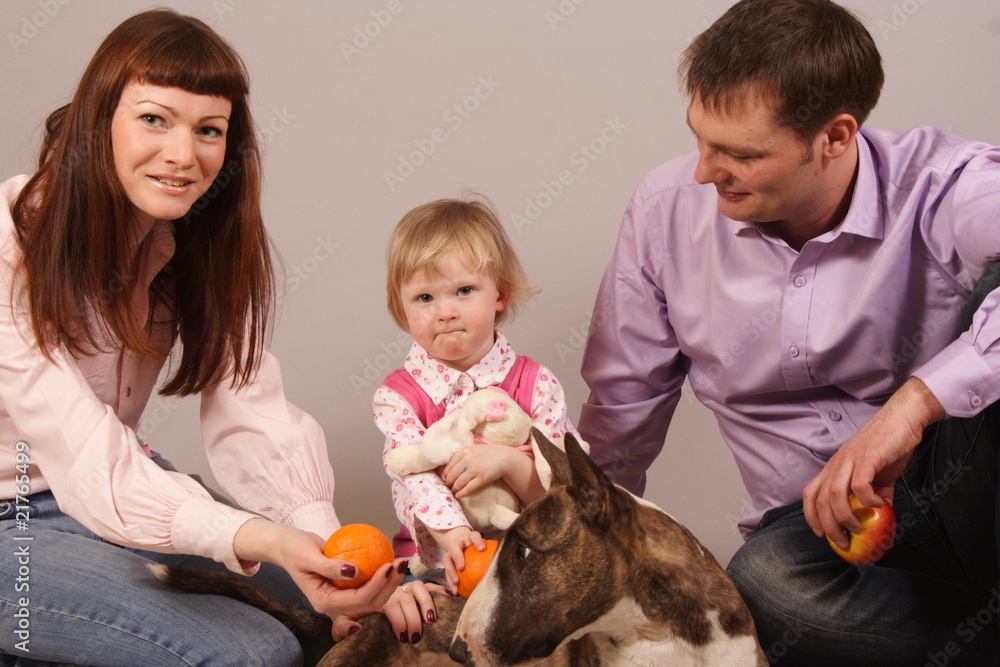 young beautiful family with dog