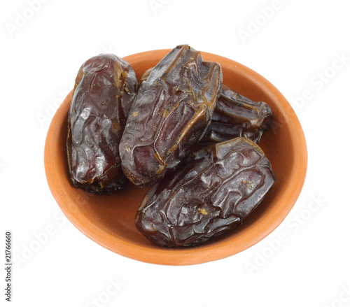 Medjool dates in a small dish